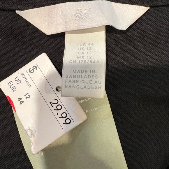 NWT H&M black dress pants with flare leg and back split size 12 - Picture 7 of 8
